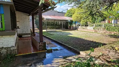 a backyard of a house with a pool of water at La casa de los titiriteros in Mina Clavero