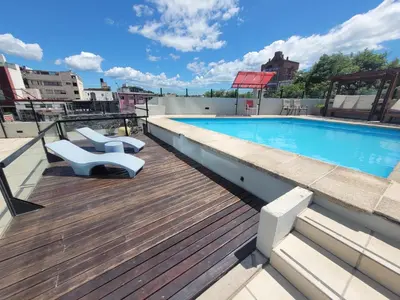 a swimming pool on the roof of a building at Apartamento Ejecutivo Premium Riviera Tower in Villa Carlos Paz