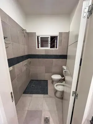 a bathroom with a toilet and a window at Remanso in Alta Gracia