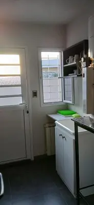 a kitchen with a white refrigerator and a window at Premium Berrotarán in Berrotarán