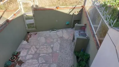 an overhead view of a patio with a stairway at Duplex al pie de las sierras in Villa Carlos Paz