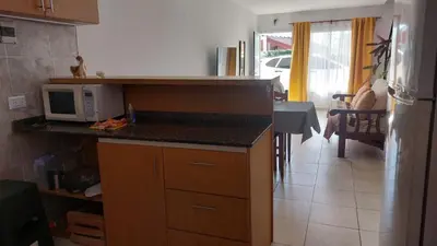 a kitchen with a counter top and a microwave at Duplex al pie de las sierras in Villa Carlos Paz