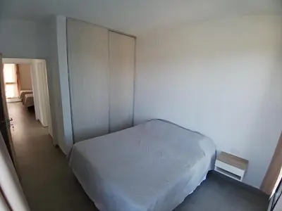 a small bedroom with a bed and a closet at Balcon del rio in Cavalango