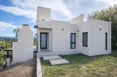 a rendering of a white house at Balcon del rio in Cavalango