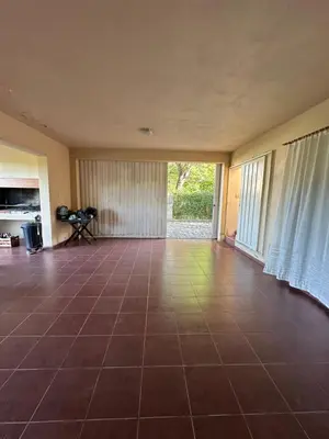 an empty room with a tile floor and a large window at Casa Siquiman in Villa Parque Siquiman