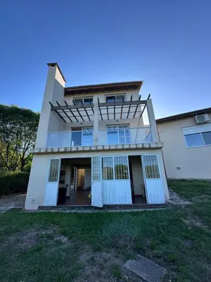 a large white house with white doors and windows at Casa Siquiman in Villa Parque Siquiman