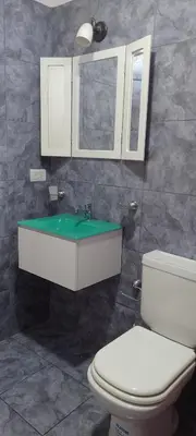 a bathroom with a toilet and a sink at Bella Fefi in Villa Cura Brochero