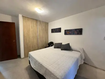 a bedroom with a bed with two pillows on it at Moderno dpto zona norte 1 dorm in Cordoba