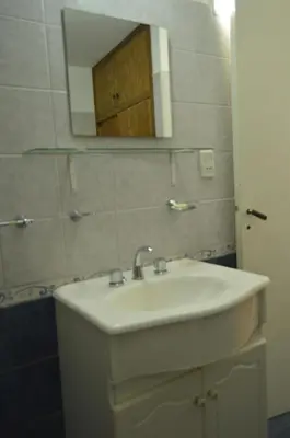a bathroom with a white sink and a mirror at Arturo in Cordoba