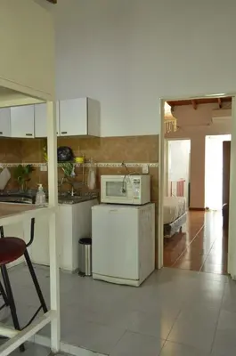 a kitchen with a white refrigerator and a microwave at Arturo in Cordoba
