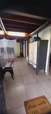 a living room with a table and a tv at Lo de Nor - Refugio de Montaña in San Antonio de Arredondo