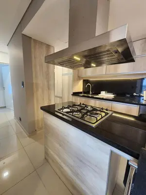 a large kitchen with a stove top oven at Civis Tower Excepcional Departamento in Villa Carlos Paz