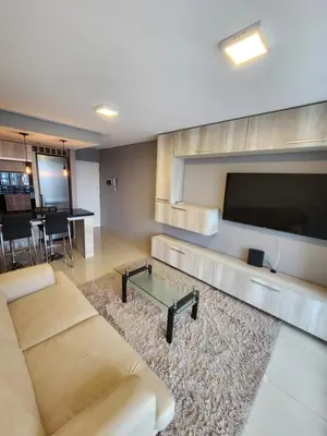a living room with a couch and a flat screen tv at Civis Tower Excepcional Departamento in Villa Carlos Paz