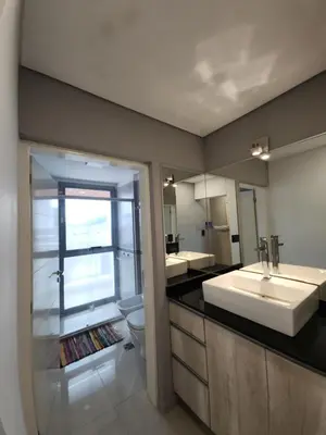 a bathroom with a sink and a toilet at Civis Tower Excepcional Departamento in Villa Carlos Paz