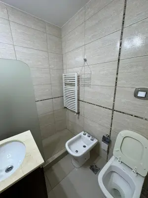 a bathroom with a toilet and a sink at Myng Departamento en el centro de Carlos Paz in Villa Carlos Paz