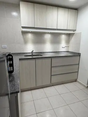 a kitchen with a sink and a counter top at Departamento PA in Villa Carlos Paz