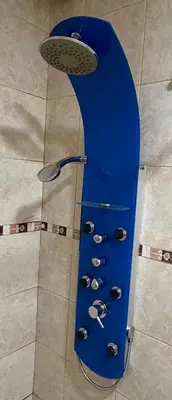 a blue board with pairs of shoes and a shower at Departamento PA in Villa Carlos Paz
