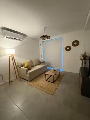 a living room with a couch and a table at New Modern Apartment Ciudad Gamma Cordoba Luxury in Cordoba