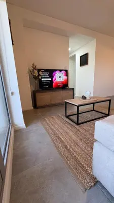 a living room with a couch and a tv at New Modern Apartment Ciudad Gamma Cordoba Luxury in Cordoba