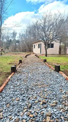 a cobblestone path in front of a house at La Eterna in Villa del Dique
