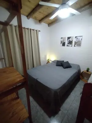 a bedroom with a bed in a room at La Eterna in Villa del Dique