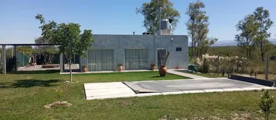a house with a skateboard ramp in a yard at Biale Masse Casa de Montaña in Bialet Massé