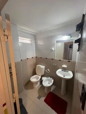 a bathroom with a toilet and a sink at La casa del varón in Mina Clavero