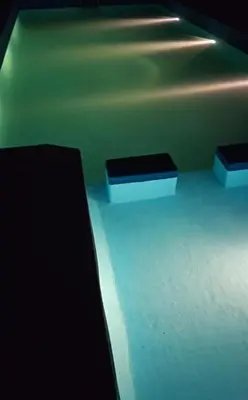 two black benches in a room with a ceiling at Casa en Cabalango para 10 personas in Cavalango