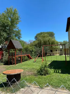 a park with a swing set and a playground at Cabañas Costa Vergel in Los Reartes