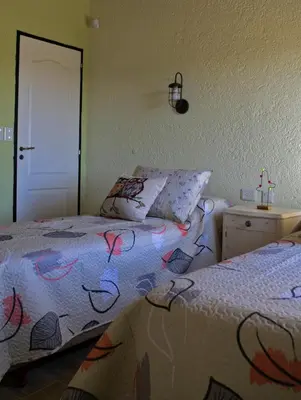 a bedroom with two beds next to each other at Tintitacos in Los Hornillos