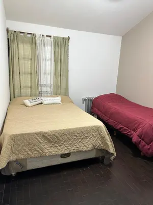 a bedroom with two beds in a room at Casa del Centro in Santa Rosa de Calamuchita