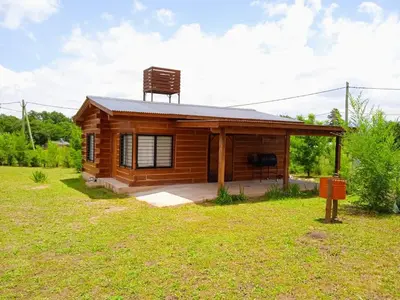 a small cabin with a chair on top of it at CabañaReartes in Los Reartes