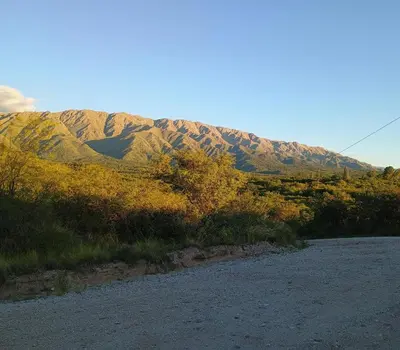 a dirt road with a mountain in the background at Casa Los Naranjos in La Paz