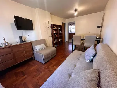 a living room with a couch and a dining room at Boulevard Uno in Cordoba