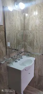 a bathroom with a white sink and a mirror at Las liebres in San Lorenzo