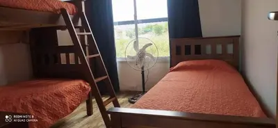 a bedroom with two bunk beds and a window at Las liebres in San Lorenzo