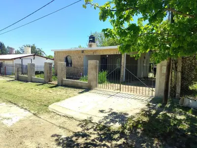 a house with a fence in front of it at Casas Los Nogales in Arroyo de Los Patos