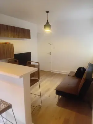 a living room with a couch and a table at Departamento en B Gral Paz, a metros de Hospital Italiano in Cordoba