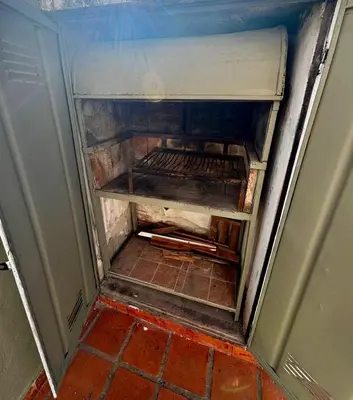 a small refrigerator with its door open in a room at Departamento Peatonal de Carlos Paz con Terraza Exclusiva in Villa Carlos Paz