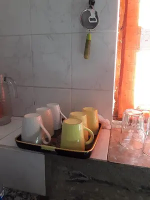 a group of cups on a tray on a counter at Cabañas San Gerónimo in San Jerónimo