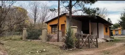 a small house in a yard with at Mainumby in Santa Rosa de Calamuchita