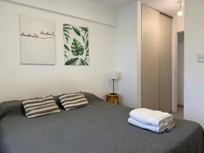 a bedroom with a bed with two pillows on it at DEPTO B GENERAL PAZ Cerca de Clínica Reina Fabiola in Cordoba