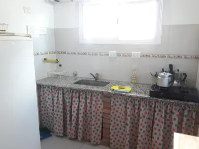 a kitchen with a sink and a window at Cabañas San Gerónimo in San Jerónimo