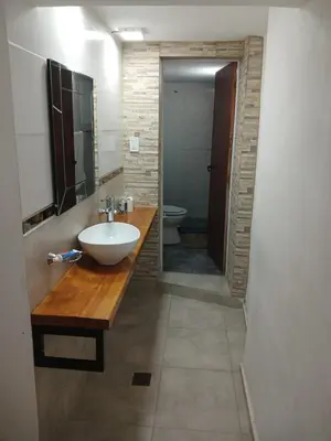 a bathroom with a sink and a toilet at Verano Paz in Villa Carlos Paz
