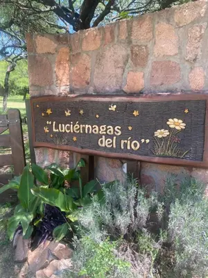 a sign for the luciferas delidno in a garden at Las Luciernagas de Nono in Nono