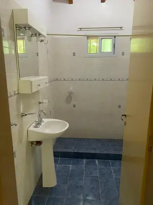 a bathroom with a sink and a mirror at Las Luciernagas de Nono in Nono