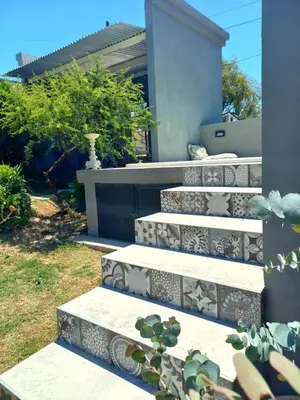a set of stairs in front of a house at La casa de Merlot in San Antonio de Arredondo