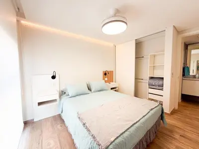 a bedroom with a large bed in a room at Relax y diseño frente a la Ciudad Universitaria in Cordoba