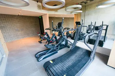 a gym with treadmills and elliptical machines at Relax y diseño frente a la Ciudad Universitaria in Cordoba