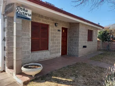 a house with a sign that reads dana ricordo at Casa Doña Victoria in Villa Carlos Paz